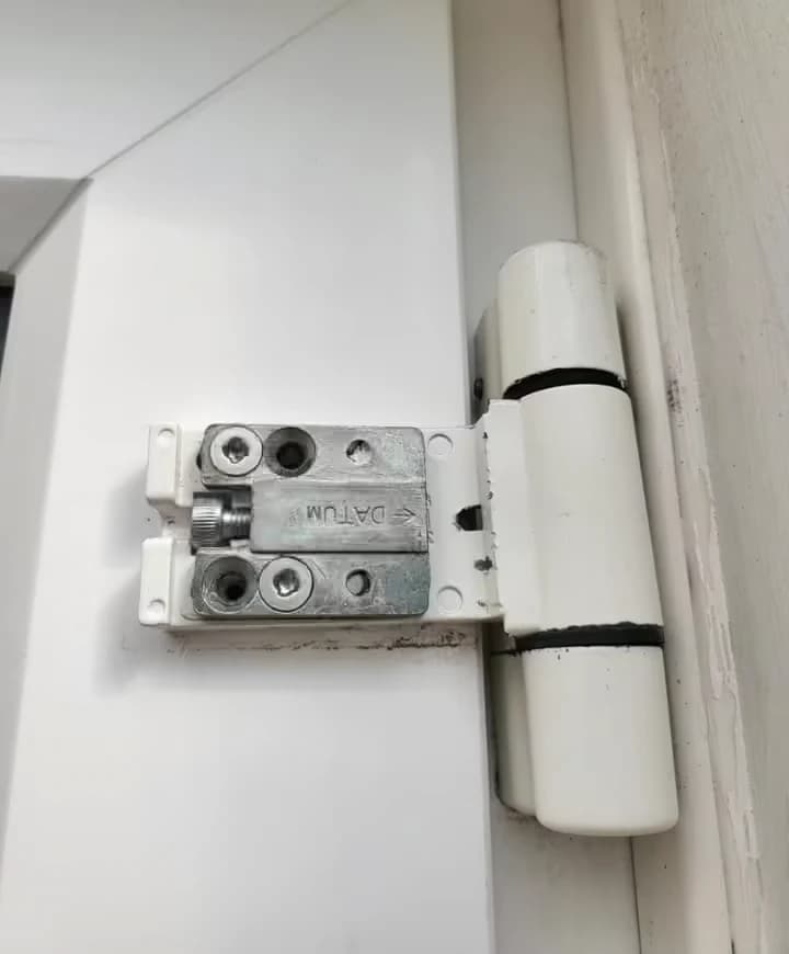 Adjusting uPVC door hinges to fix a door that will not close
