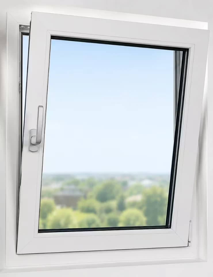 Tilt and turn window with the top tilted inwards and the handle pointing up